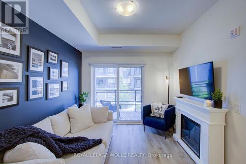 #208 - 243 Northfield Drive E, Waterloo, ON - Indoor Photo Showing Living Room With Fireplace