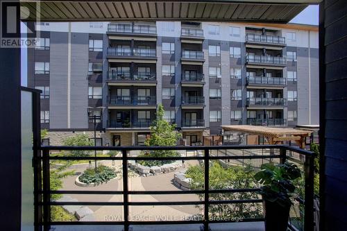 private patio view - #208 - 243 Northfield Drive E, Waterloo, ON - Outdoor With Balcony