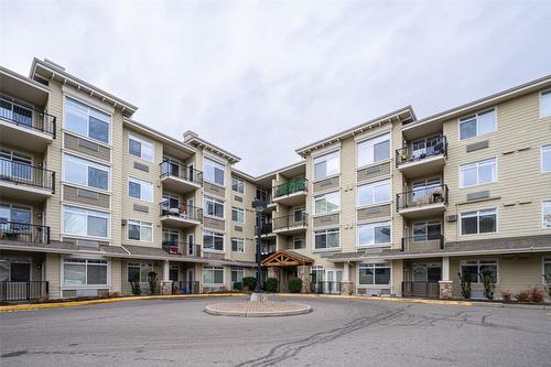 211-1350 Ridgeway Drive, Kelowna, BC - Outdoor With Balcony With Facade