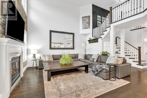 family - 2099 Helmsley Avenue, Oakville (Wm Westmount), ON - Indoor Photo Showing Living Room With Fireplace