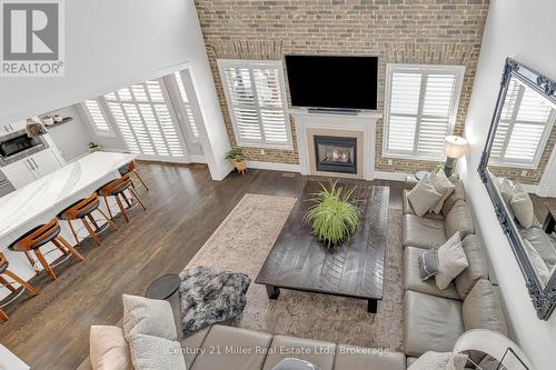 family - 2099 Helmsley Avenue, Oakville (Wm Westmount), ON - Indoor Photo Showing Living Room With Fireplace