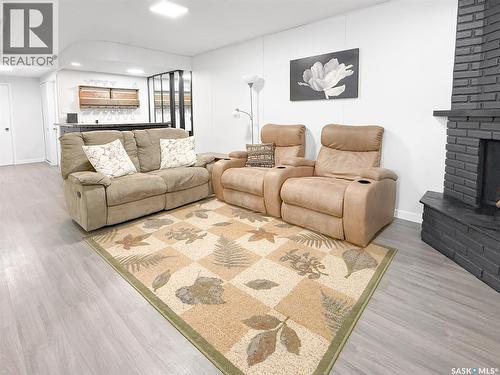 426 15Th Avenue Ne, Swift Current, SK - Indoor Photo Showing Living Room With Fireplace
