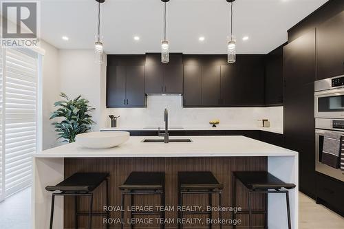 Images provided are to showcase builder finishes. - 1043 Elixir Place, Ottawa, ON - Indoor Photo Showing Kitchen With Upgraded Kitchen