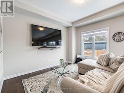 Warm living area with engineered hardwood floors - 