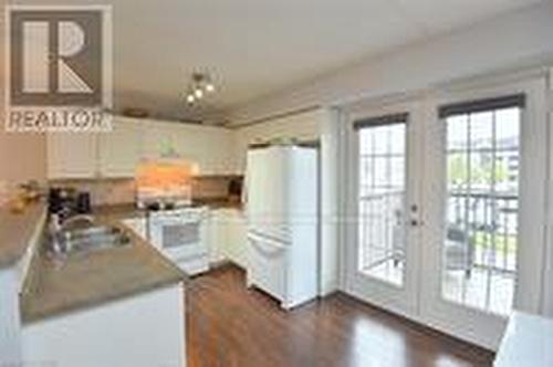 202 - 1411 Walkers Line, Burlington (Tansley), ON - Indoor Photo Showing Kitchen With Double Sink