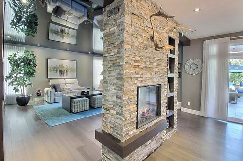 Overall view - 101 Rue Des Cormorans, Val-D'Or, QC - Indoor Photo Showing Living Room With Fireplace