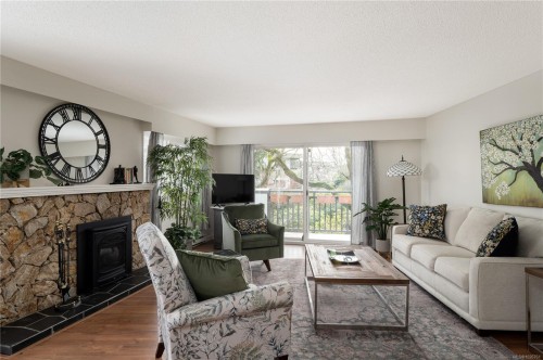 116-3962 Cedar Hill Rd, Saanich, BC - Indoor Photo Showing Living Room With Fireplace