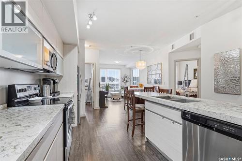 213 223 Evergreen Square, Saskatoon, SK - Indoor Photo Showing Kitchen With Double Sink With Upgraded Kitchen