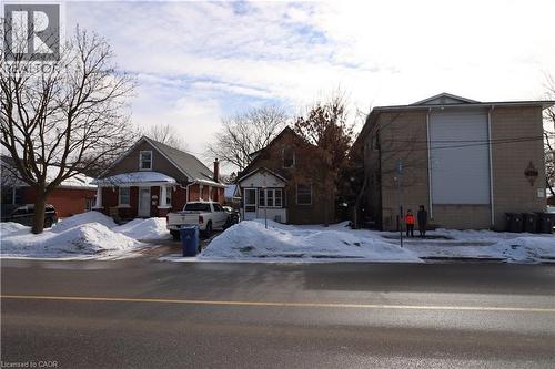 Full of character and original charm, this gable-roofed beauty features a welcoming front porch, a convenient rear mudroom (ready for finishing), and hardwood floors throughout for a timeless feel the - 344 Paisley Road, Guelph, ON - Outdoor