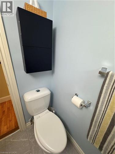 The 2022 bathroom renovation ($9,715.93) adds modern style with subway-tile finishes and a unique peek-a-boo shower window. - 344 Paisley Road, Guelph, ON - Indoor Photo Showing Bathroom