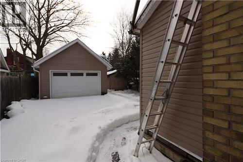 A standout feature of this property is the 2020-built air source assist heated garage, complete with a loft bed\den with skylight, & Lift Master automatic door opener. This incredible space—built at a - 344 Paisley Road, Guelph, ON - Outdoor With Exterior