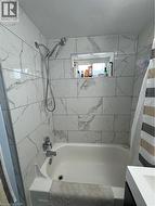 The 2022 bathroom renovation ($9,715.93) adds modern style with subway-tile finishes and a unique peek-a-boo shower window. - 