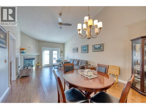 104 9803 117 Avenue, Fort St. John, BC - Indoor Photo Showing Dining Room With Fireplace