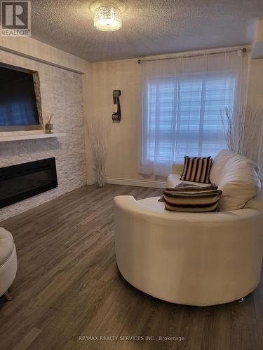 19 Albery Road, Brampton, ON - Indoor Photo Showing Living Room With Fireplace
