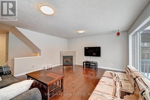 242 Doon Mills Drive, Kitchener, ON - Indoor Photo Showing Living Room With Fireplace
