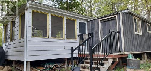 stairs from sunroom and utility/laundry closet - 168 Lakebreeze Road, Kawartha Lakes (Fenelon), ON - Outdoor With Exterior
