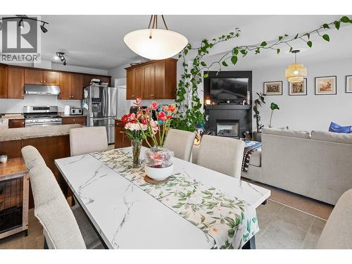2003 Montego Street, West Kelowna, BC - Indoor Photo Showing Dining Room With Fireplace