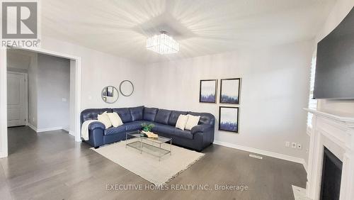 7 Spokanne Street, Brampton, ON - Indoor Photo Showing Living Room With Fireplace