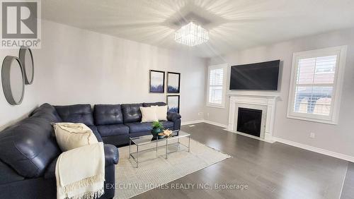 7 Spokanne Street, Brampton, ON - Indoor Photo Showing Living Room With Fireplace