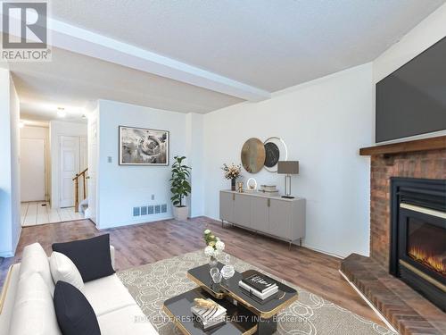 78 - 2275 Credit Valley Road, Mississauga, ON - Indoor Photo Showing Living Room With Fireplace
