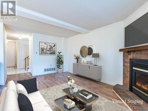 78 - 2275 Credit Valley Road, Mississauga, ON - Indoor Photo Showing Living Room With Fireplace