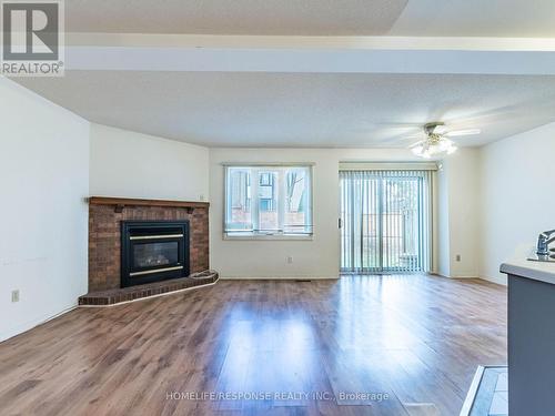 78 - 2275 Credit Valley Road, Mississauga, ON - Indoor Photo Showing Living Room With Fireplace
