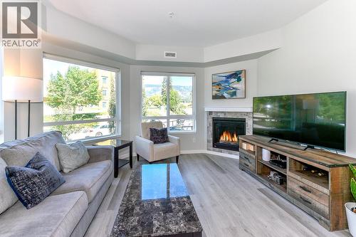 Corner unit, big windows, gas fireplace. - 2301 Carrington Road Unit# 109, West Kelowna, BC - Indoor Photo Showing Living Room With Fireplace