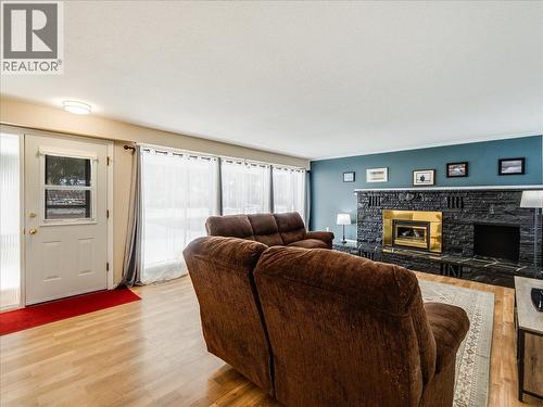 2329 5Th Avenue, Castlegar, BC - Indoor Photo Showing Living Room With Fireplace