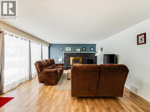 2329 5Th Avenue, Castlegar, BC - Indoor Photo Showing Living Room With Fireplace