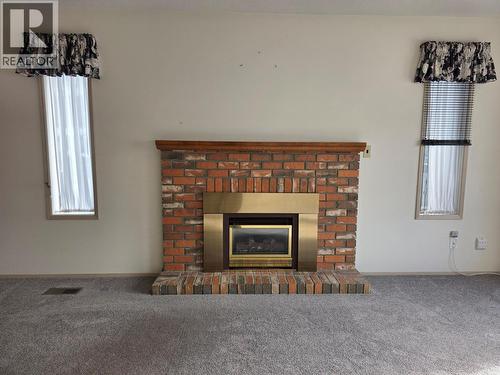 6660 21St Street, Grand Forks, BC - Indoor Photo Showing Living Room With Fireplace