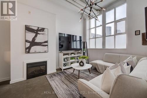 126 - 410 King Street W, Kitchener, ON - Indoor Photo Showing Living Room With Fireplace