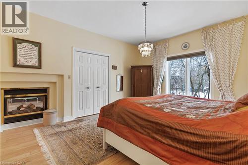 5114 Meadowood Lane, Beamsville, ON - Indoor Photo Showing Bedroom With Fireplace