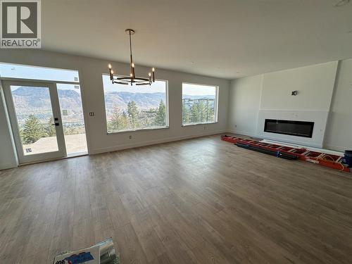 Dining/Living - 2170 Galore Crescent, Kamloops, BC - Indoor Photo Showing Living Room With Fireplace