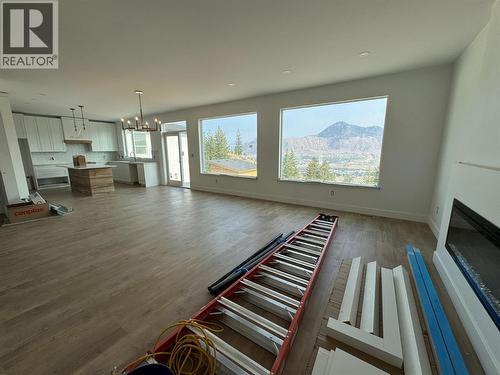 Dining/Living/Kitchen - 2170 Galore Crescent, Kamloops, BC - Indoor Photo Showing Living Room With Fireplace