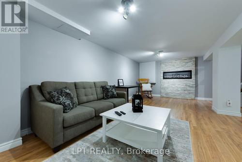 34 Cedar Creek Road, Springwater, ON - Indoor Photo Showing Living Room With Fireplace