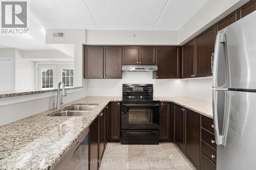 310 - 1470 Main Street E, Milton, ON - Indoor Photo Showing Kitchen With Double Sink