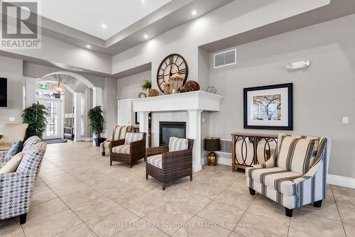 310 - 1470 Main Street E, Milton, ON - Indoor With Fireplace