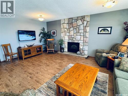 403 8Th Avenue W, Biggar, SK - Indoor Photo Showing Living Room With Fireplace