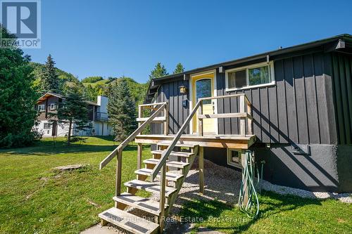 Front of the chalet with ski hills in background - 158 Wensley Drive, Blue Mountains, ON - Outdoor