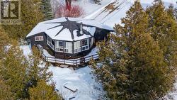 View of expansive back deck looking at ski hills - 