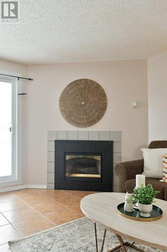 104 - 729 Deveron Crescent, London South (South T), ON - Indoor Photo Showing Living Room With Fireplace