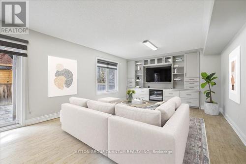 Photo has been digitally staged. - 32 Harborn Road, Mississauga, ON - Indoor Photo Showing Living Room With Fireplace