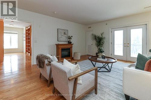 308 - 25 Beaver Street S, Blue Mountains, ON - Indoor Photo Showing Living Room With Fireplace