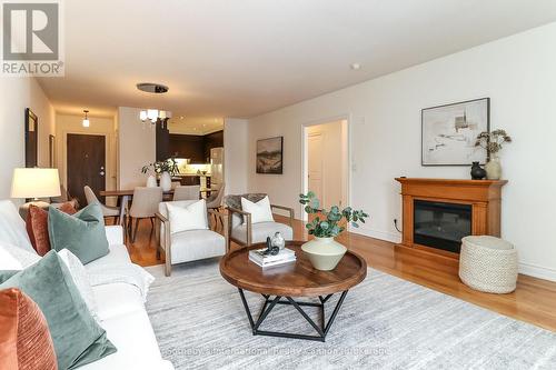 308 - 25 Beaver Street S, Blue Mountains, ON - Indoor Photo Showing Living Room With Fireplace