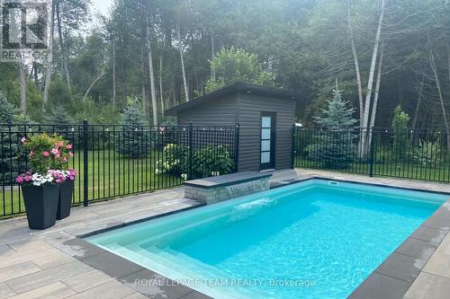Gorgeous salt water fibreglass heated pool w/shed - 295 Ridgemont Drive, Beckwith, ON - Outdoor With In Ground Pool