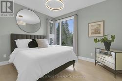 2nd bedroom featuring hardwood flooring - 