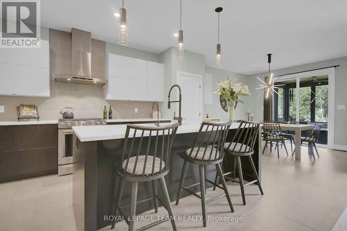 Convenient work island w/pendant lighting - 295 Ridgemont Drive, Beckwith, ON - Indoor Photo Showing Kitchen With Upgraded Kitchen