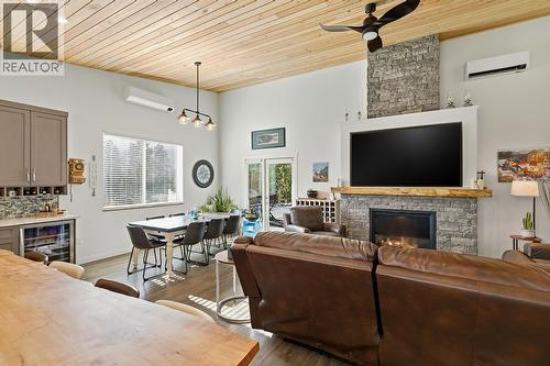7145 Dunwaters Road, Kelowna, BC - Indoor Photo Showing Living Room With Fireplace