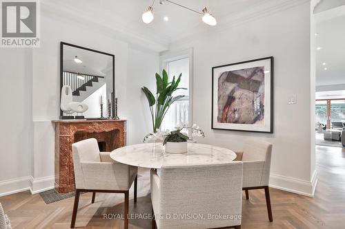 Elegant dining room with marble fireplace - 69 Sullivan Street, Toronto, ON - Indoor Photo Showing Dining Room