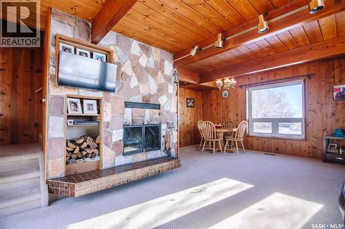 Mccoy Acreage, Dufferin Rm No. 190, SK - Indoor Photo Showing Living Room With Fireplace